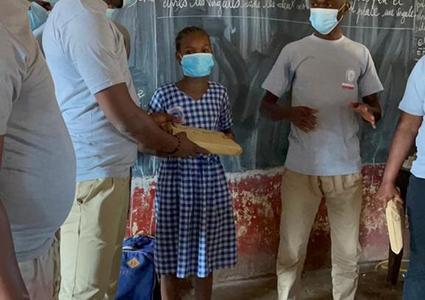 Bureau Veritas team distributing school kits